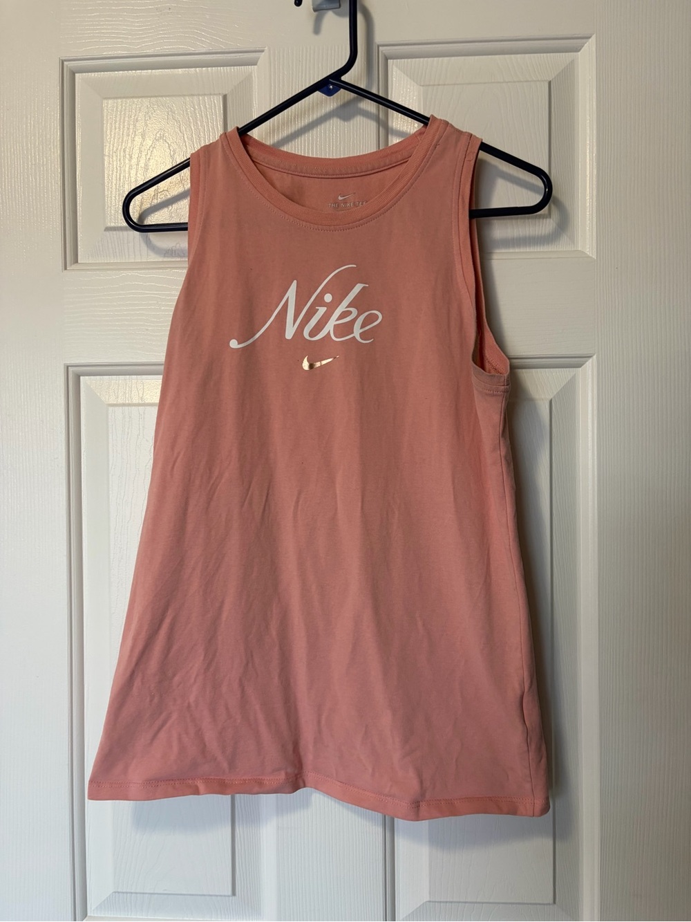Light pink Nike tank top